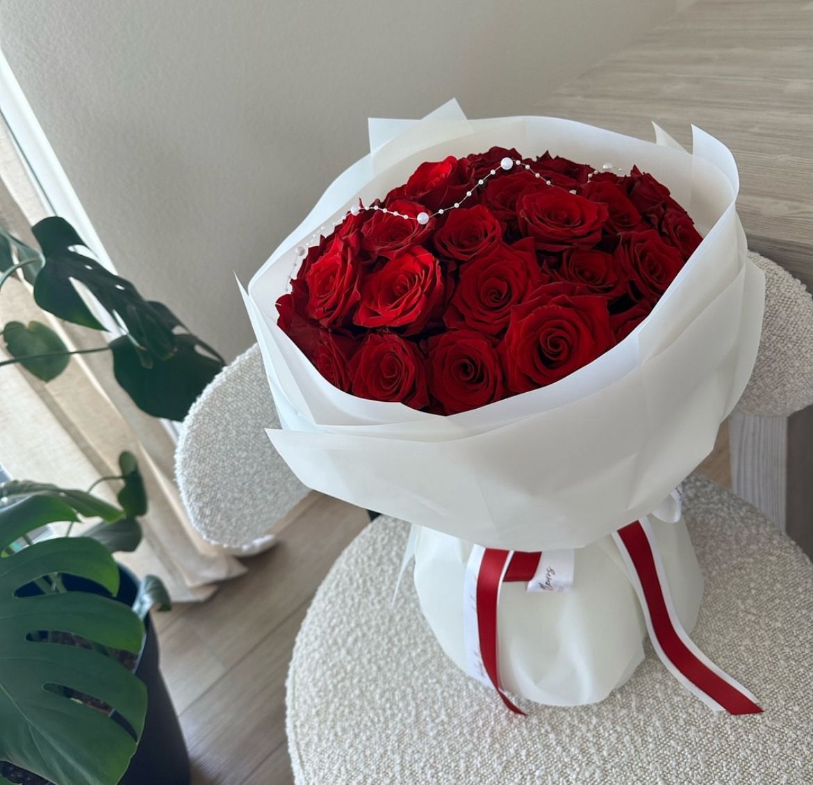 Red rose bouquet hand wrapped