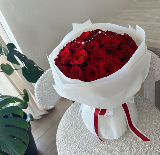 Red rose bouquet hand wrapped